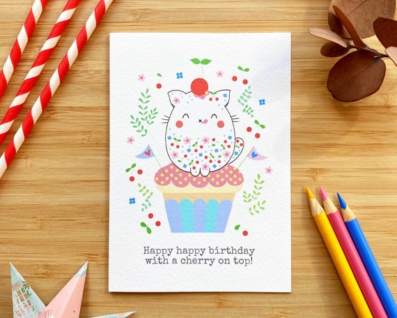 Cute cat with cupcake birthday card. Happy happy birthday with a cherry on top!