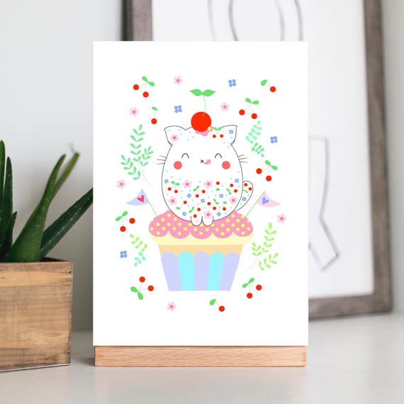 A4 / A5 unframed print. Cute cat sitting on a cupcake, with cherries, flowers and leaves