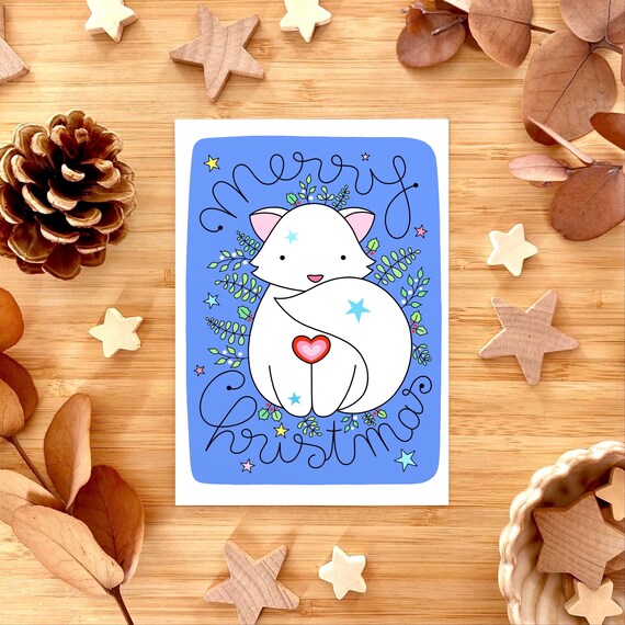 Snow fox Christmas card. Cute winter fox card. White fox with winter foliage. Cute Christmas card.