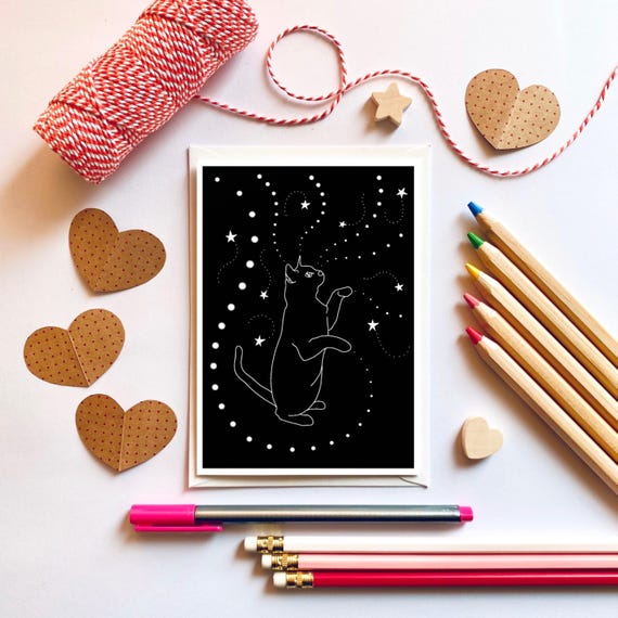 Black cat playing with stars, greeting card. Halloween card.