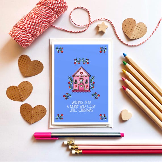 Wishing you a merry and cosy little Christmas. Cute winter cottage Christmas card.