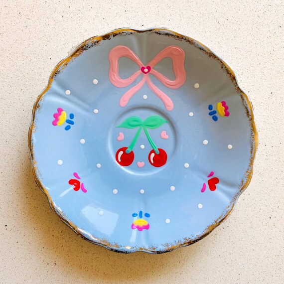 Hand painted vintage plate with cute cherries, flowers and a pink bow. Decorative wall plate, retro inspired decor.