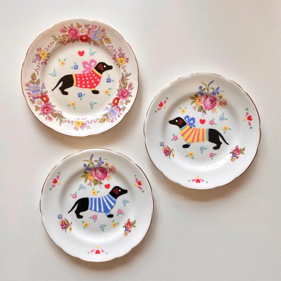 One vintage porcelain plate hand painted with a cute dachshund. Decorative wall plate.