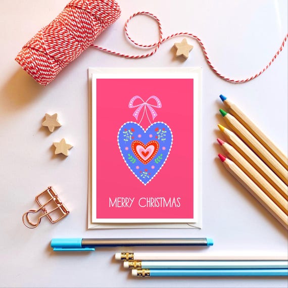 Merry Christmas card. Christmas card with a Scandi style heart and a bow.