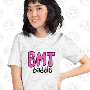 May include: White t-shirt with a pink graphic that says "BMT baddie".