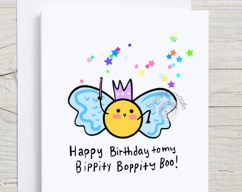 May include: A yellow fairy with blue wings and a crown holding a wand with stars in the background. The card says "Happy Birthday to my Bippity Boppity Boo!"