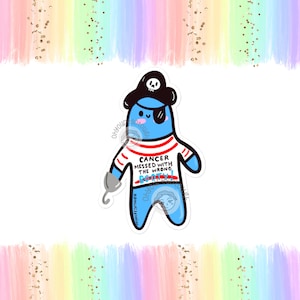 Peut inclure: Un pirate de dessin animé bleu avec une chemise à rayures rouges et blanches et un cache-œil. Le pirate tient un crochet et a un crâne et des os croisés sur son chapeau. Le texte sur la chemise dit "Cancer messed with the wrong booty!"