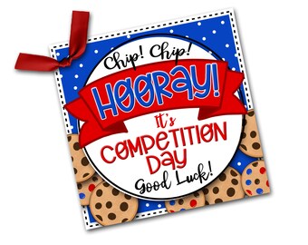 May include: A blue and white polka dot background with a red ribbon and a white circle with the text "Chip! Chip! Hooray! It's Competition Day Good Luck!" and a border of chocolate chip cookies.