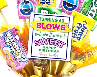 May include: A birthday card with a colorful design and the text "Turning 60 Blows but you'll make it Sweet Happy Birthday Shan & Jennifer". The card is surrounded by various candy wrappers, including Bubble Yum, Juicy Fruit, and Extra.