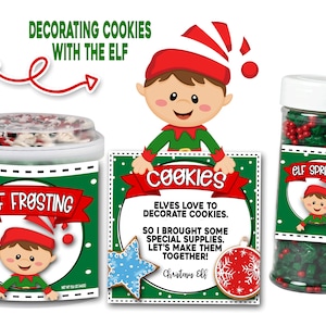 May include: A Christmas cookie decorating kit featuring a green and red elf design. The kit includes a jar of white frosting, a jar of green and red sprinkles, and a card that reads "Elves love to decorate cookies. So I brought some special supplies. Let's make them together! Christmas Elf."
