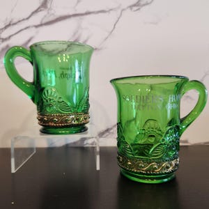 EAPG Antique Green Glass Tall Mugs in Colorado / Lacy Medallion Pattern in Gold Set of 2 - Souvenir St. Joseph MI & Dayton, Ohio - USA