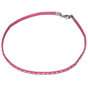 May include: A pink suede choker necklace with a silver clasp and a row of clear rhinestones.