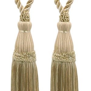 May include: Two beige tassel tiebacks with a rope design. The tassels are made of a soft, woven fabric and have a fringe trim.