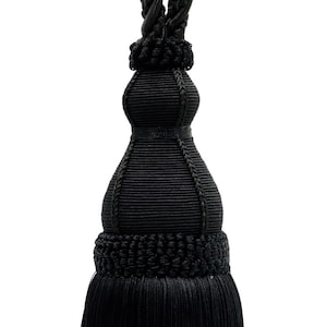 May include: Black tassel tieback with a thick, twisted rope design and a long, fringed tassel.