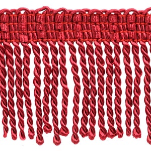 May include: Red twisted fringe trim with a woven top. This trim is perfect for adding a touch of elegance to any project.