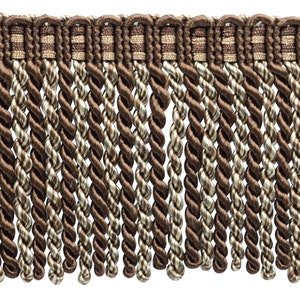 May include: Brown and beige twisted fringe trim with a woven band. The fringe is approximately 2 inches long.