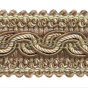 May include: A close-up of a brown and beige braided trim with a rope-like design. The trim has a textured, woven appearance.
