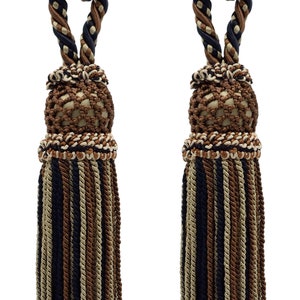 May include: Two decorative curtain tiebacks. Each tieback features a knotted rope design in shades of brown, tan, and navy blue. The tassels are made of twisted cords in matching colors, adding a touch of elegance to any window treatment.