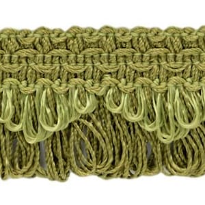 May include: Green fringe trim with a woven design. The fringe is about 1 inch long.