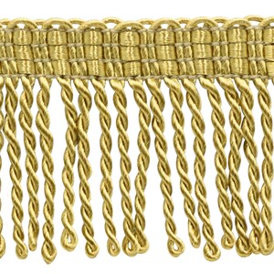May include: Gold twisted fringe trim with a woven top. The fringe is approximately 1 inch long.