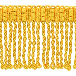 May include: Gold twisted fringe trim with a woven top. This trim is perfect for adding a touch of elegance to any project.