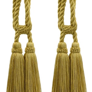 May include: Two pairs of gold tassel tiebacks with a rope design. The tassels are made of a soft, woven fabric.