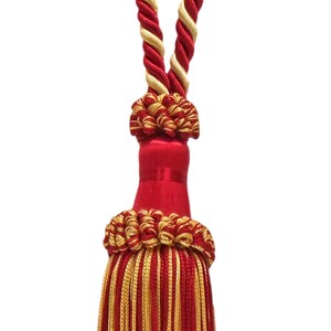 May include: Red and gold tassel with a twisted rope cord. The tassel is made of multiple strands of red and gold thread.