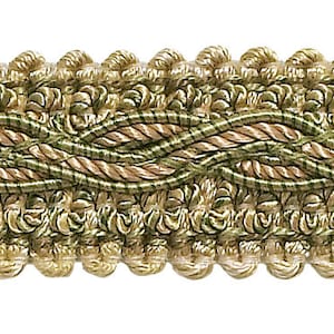 May include: A close-up of a beige and green braided trim with a decorative pattern. The trim is made of woven fabric and has a subtle sheen.