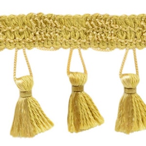 May include: Gold decorative trim featuring a woven top section and hanging tassels. The tassels are evenly spaced and attached with a loop. The trim is a consistent gold colour, suitable for various craft and design projects.