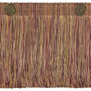 May include: Multicolored fringe trim with a brown woven band and two green and gold decorative knots.