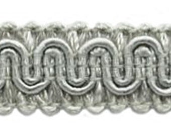 May include: Silver braided trim with a wavy, scalloped design. The trim is approximately 2.5 cm wide.