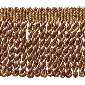 May include: Red and gold twisted fringe trim. The fringe is made of a woven fabric with a subtle sheen.
