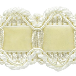 May include: Cream-colored trim with a scalloped edge and a woven design. The trim has a satin-like finish and is perfect for adding a touch of elegance to any project.