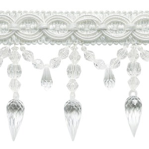 May include: White beaded trim with crystal-like teardrop accents. The trim has a scalloped design and is perfect for adding a touch of elegance to curtains, pillows, or other home decor projects.
