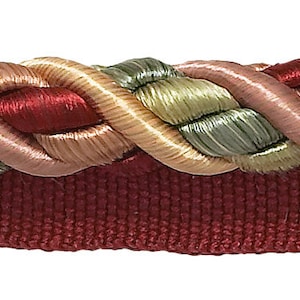 May include: A braided trim featuring a red, pink, beige and green colour scheme. The trim is woven with a rope-like texture.