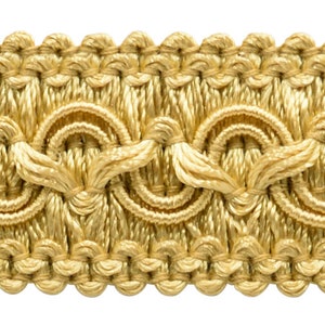 May include: Gold trim with a repeating pattern of circles and leaves. This trim is woven and has a subtle sheen.