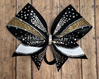 Lazo de animadora con diamantes de imitación negros y dorados: accesorio para el cabello del equipo de competición