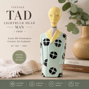 May include: Vintage ceramic sculpture of a man with a lightbulb head, wearing a light blue coat with black circular patterns. The sculpture has a yellow head and collar. Text on the image reads "TAD LIGHTBULB HEAD MAN 1989".