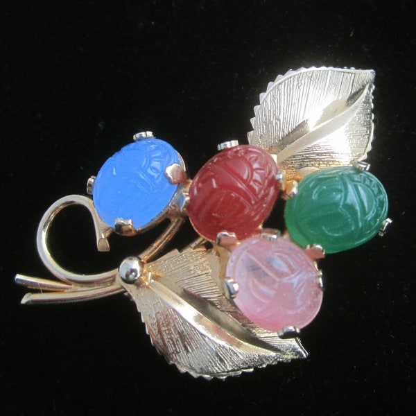 Vintage Egyptian Revival Scarab Brooch with Flower Bouquet of Carved Semi Precious Stones and Gold Tone Leaves