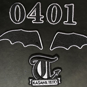May include: A collection of black and white embroidered patches. The set includes the numbers "0401", two bat wing designs, and a logo with the text "KASANE TETO". These patches are suitable for customising garments or accessories.