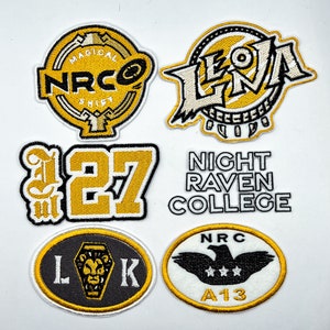 May include: Six embroidered patches with a yellow and black color scheme. The patches feature various designs, including a logo with the text "NRC" and "Magical Shift", a logo with the text "Leona Crew", a logo with the text "Night Raven College", a number "27", a logo with the text "LK", and a logo with the text "NRC A13".