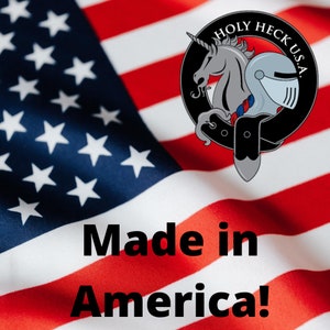 Background of an American flag with "Made in America" text and the Holy Heck logo in foreground.