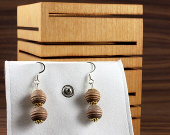 Earrings made of colored wooden beads with golden ornamentation. Unique model in limited quantity!