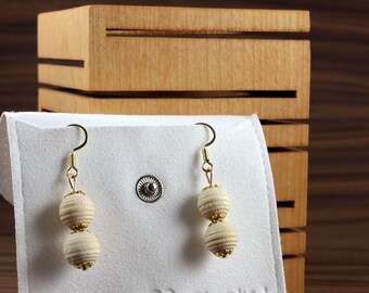 Earrings made of colored wooden beads with golden ornamentation. Unique model in limited quantity!