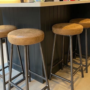 Leather upholstered kitchen bar stools on steel frame