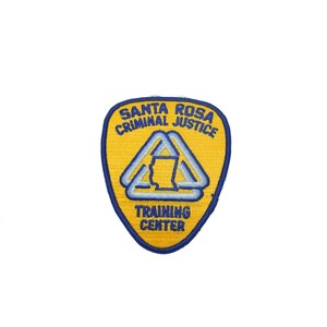 May include: Yellow and blue embroidered patch with the text "Santa Rosa Criminal Justice Training Center" and a stylized image of three overlapping triangles.