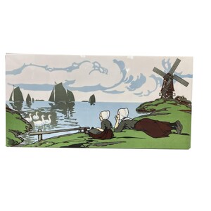 May include: Two figures in traditional Dutch clothing sit on a grassy hill overlooking a body of water with sailboats and swans. A windmill stands on a hill in the background.