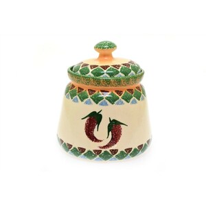 May include: A ceramic jar with a lid, decorated with green, blue, and brown geometric patterns. The jar has a white background with two red chili peppers painted on the front.