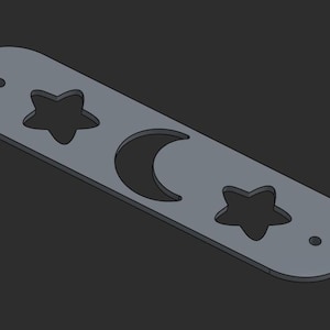 May include: A grey metal bar featuring a crescent moon and two star cut-outs. The bar has two small holes and rounded edges. The design has a celestial theme.
