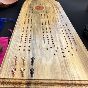 Solid wood cribbage board